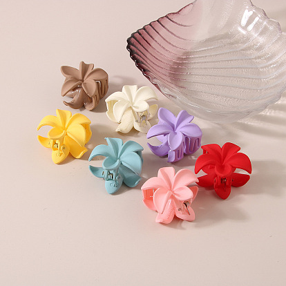 Candy-colored plastic flower hairpin with hollow-out design - simple and elegant.
