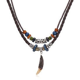 Винтажная одежда и аксессуары в этническом стиле - кожаное ожерелье с подвеской в виде клыка, многослойный, длинный.