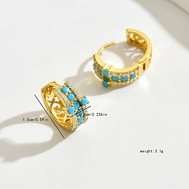 Élégantes boucles d'oreilles créoles en argent sterling avec croix verte et turquoise synthétique