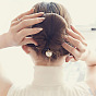 Pince à cheveux en perles pour coiffure princesse - accessoire pour cheveux élégant et stylé.
