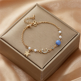 Stylish Pearl Bracelet with Diamond-Encrusted Star and Moon Charms for Women