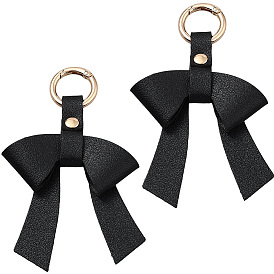 Брелок из искусственной кожи и сплава с бантом