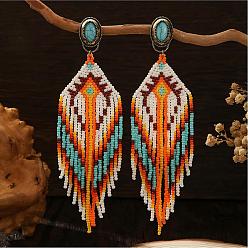 Оранжевый Богемные серьги-гвоздики ручной работы из стеклянного бисера с кисточками., с синтетическими бирюзовый, овал с рисунком ромба, античная бронза, оранжевые, 130x36 мм