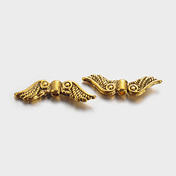 Antique Golden Tibetan Style Alloy Beads, Cadmium Free &, Lead Free, Wing, Antique Golden Color, Size: about 7mm long, 23mm wide, 3mm thick, hole: 1.5mm, 1380pcs/1000g